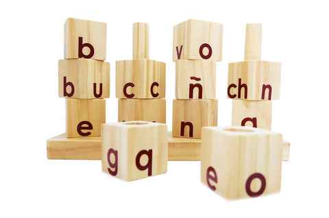 Wooden alphabet blocks, likely part of a spelling or letter-matching game for children